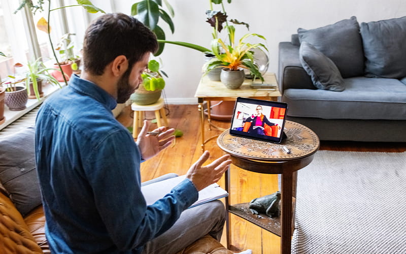 Over the shoulder view of person using the website.