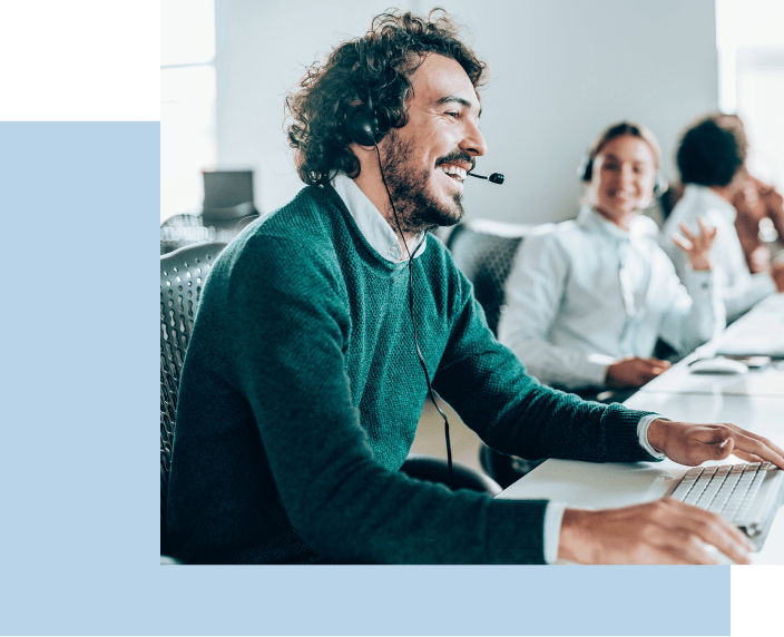 Call center employee smiling while on call